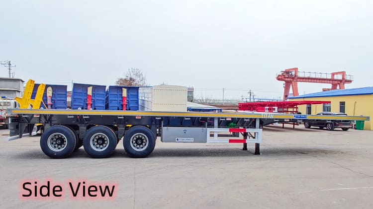 Camion à trois essieux avec remorque à plateau à Trinité-et-Tobago