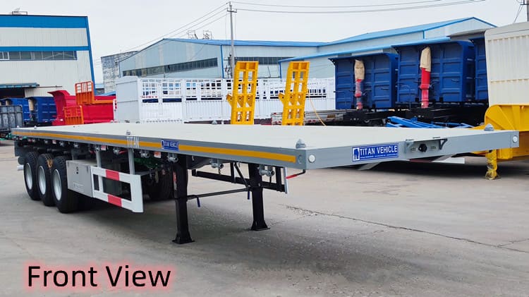 Camion à trois essieux avec remorque à plateau à Trinité-et-Tobago